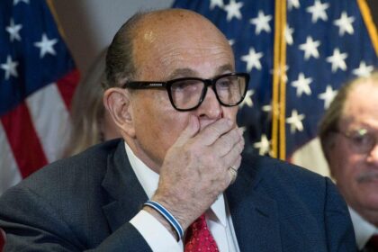 Disgraced ex-Trump lawyer Rudy Giuliani falls from his chair at RNC