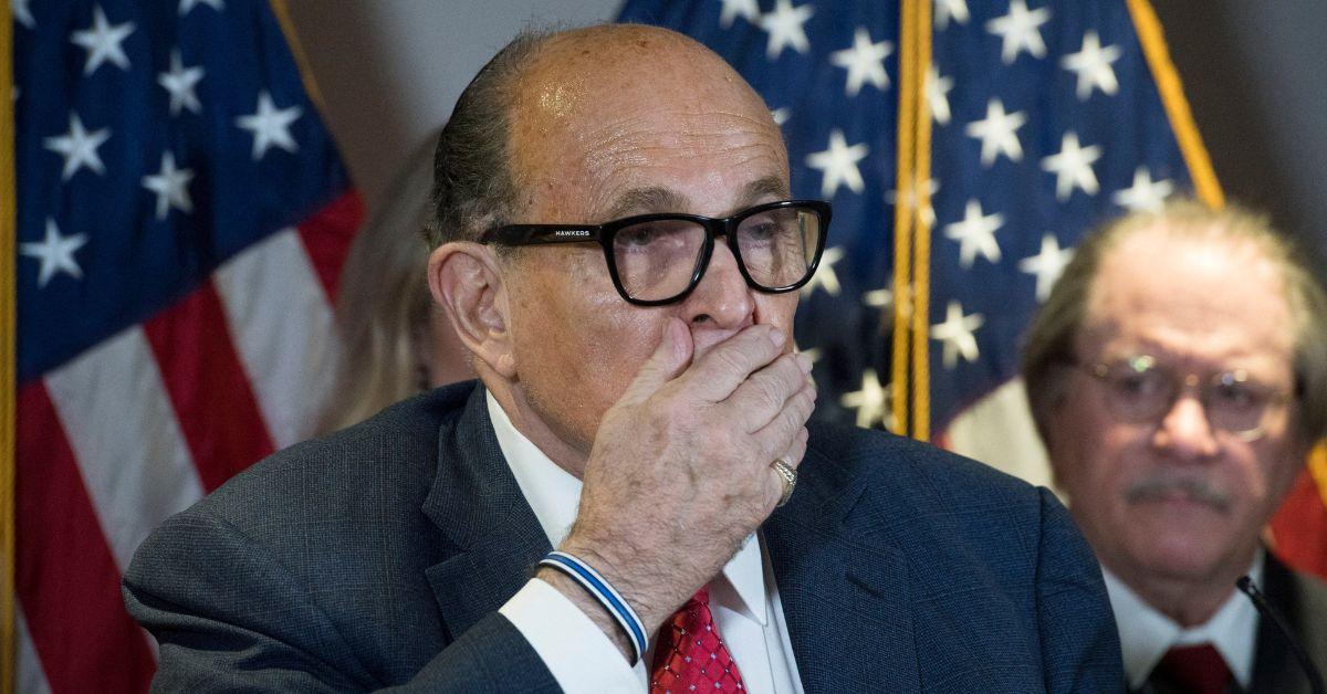 Disgraced ex-Trump lawyer Rudy Giuliani falls from his chair at RNC