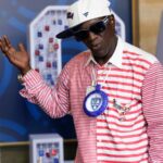 Flavor Flav enjoys his first Olympic experience and cheers on the US water polo teams