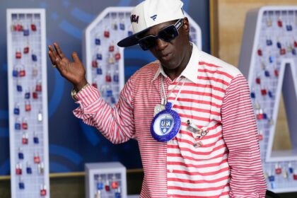 Flavor Flav enjoys his first Olympic experience and cheers on the US water polo teams