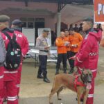 Rescuers search for dozens of people buried in an Indonesian landslide that killed at least 17 people