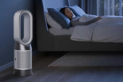 Dyson Hot+Cool Gen1 in a bedroom, next to a sleeping woman