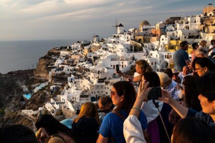 Tourism has hijacked Santorini's wine production as farmland becomes exorbitant while visitor numbers continue to rise