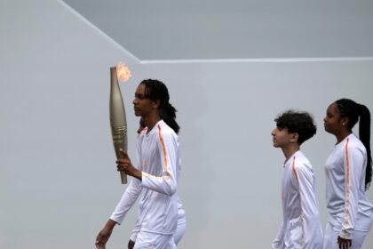 Who will carry the Olympic torch through Paris?  A BTS star, a garbage collector and more