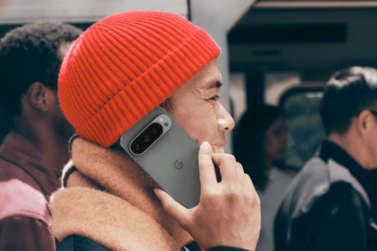 Man in red hat using Pixel 9 Pro for a phone call