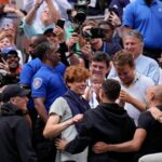 Jannik Sinner gets a hug from his friend Seal after winning the US Open title