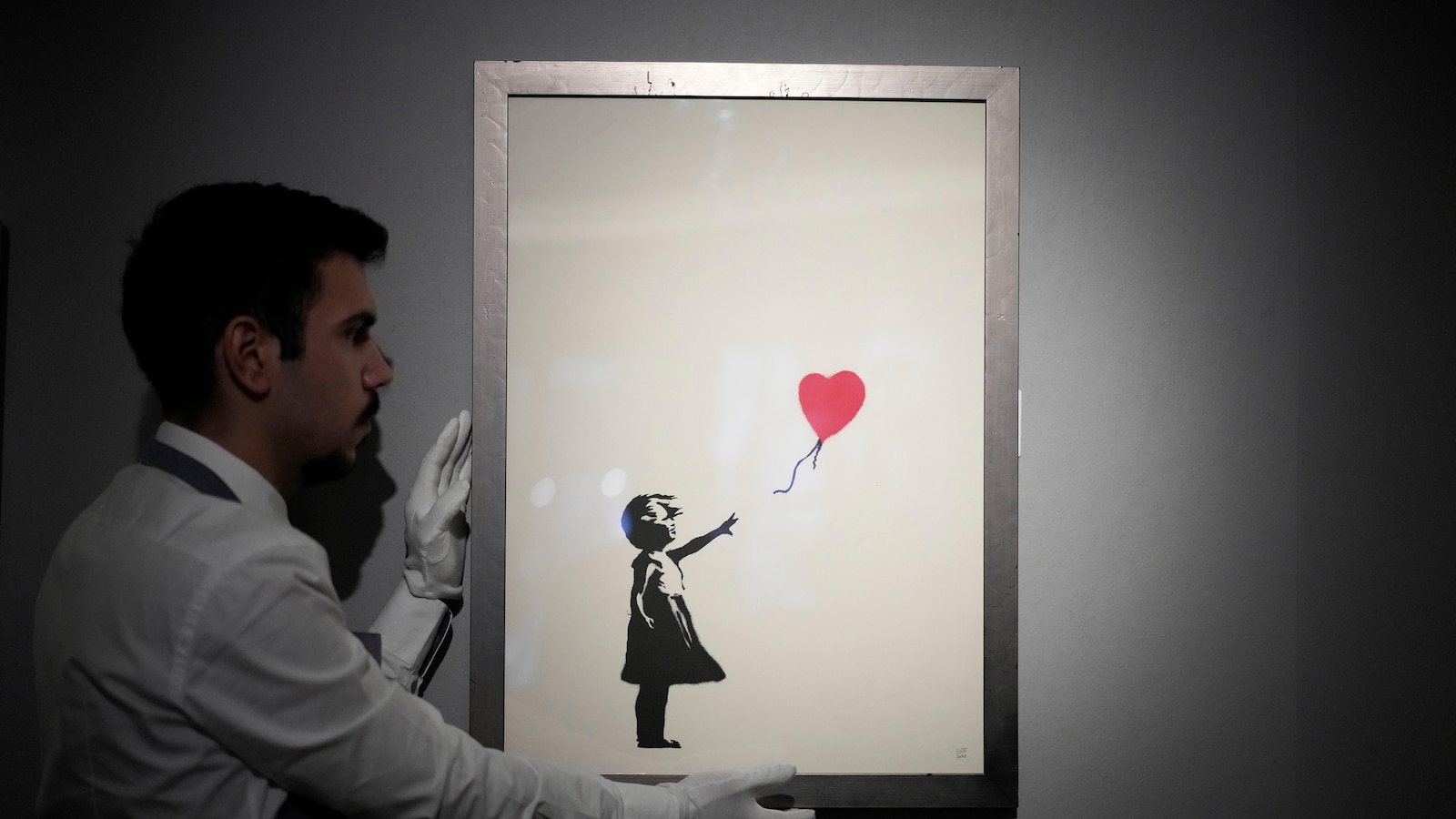 Two men accused of stealing a famous Banksy statue from a London art gallery